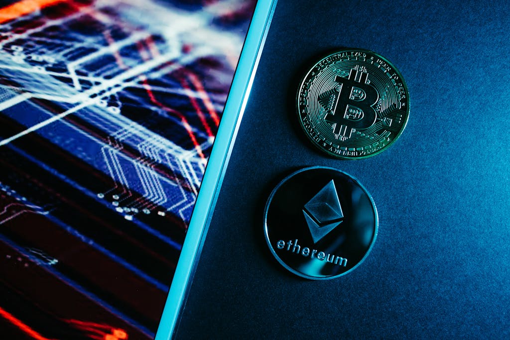 Bitcoin and Ethereum coins on a digital circuitry background symbolizing blockchain technology.